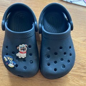 Toddler size 7 CROCS with two Jibits